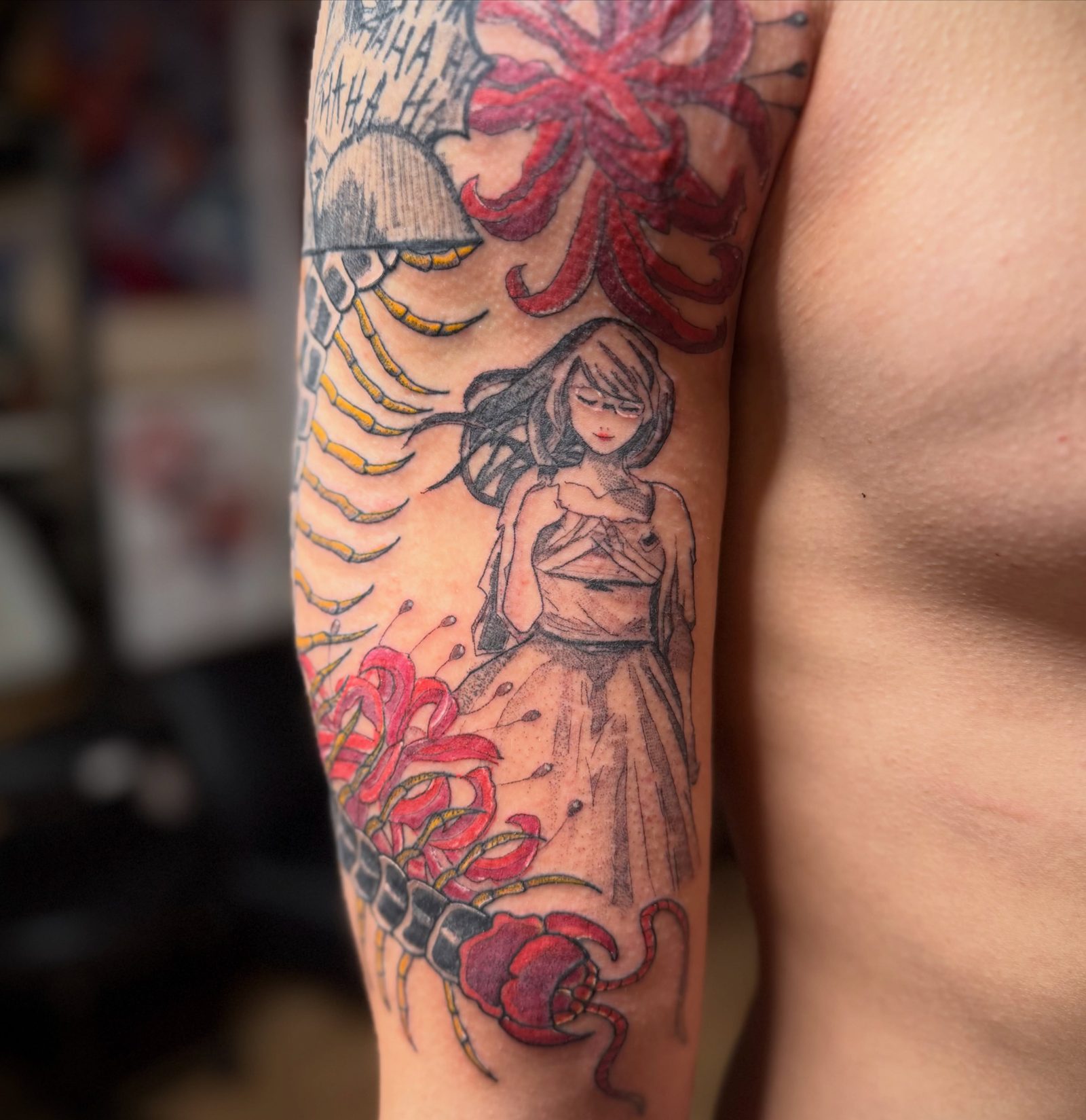 A Japanese-style sleeve in colour across a shoulder and upper arm