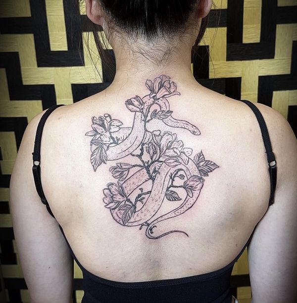 Floral x Snake custom tattoo by LoLo, on the upper back